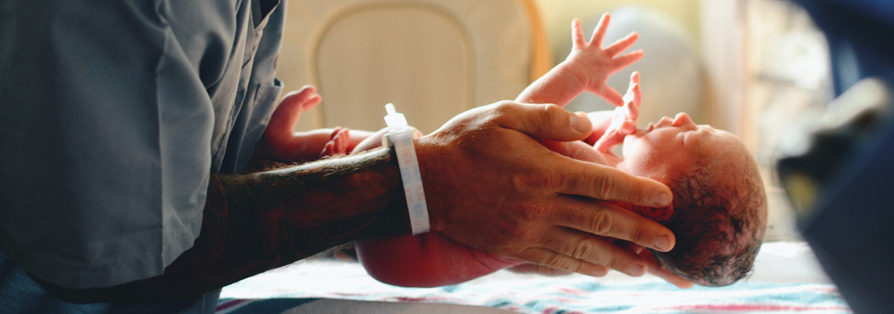 Georgia Tech 2022 Health Stories, nurse holding new born baby