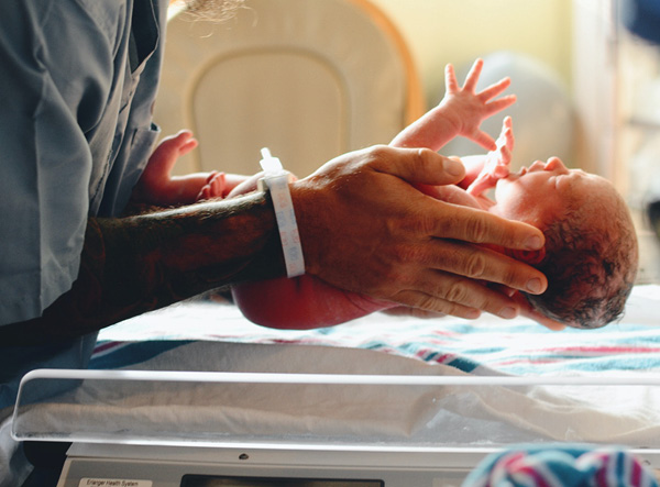 Nurse holding a new born baby
